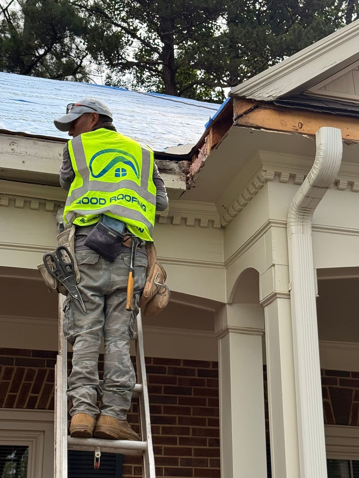 Good Roofing technician repairing a shingle roof